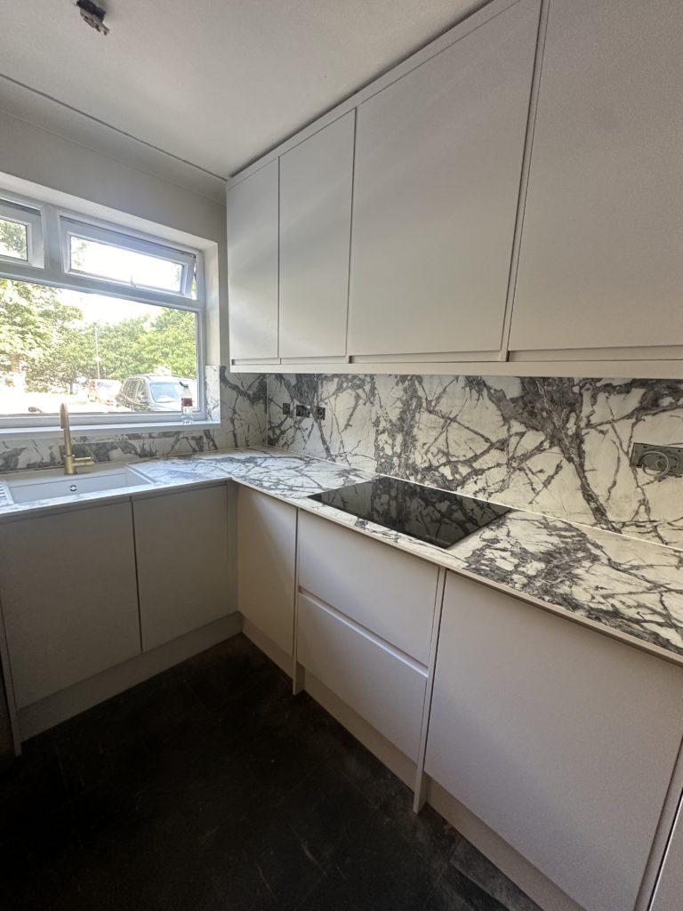 Kitchen renovation with marble effect splashback