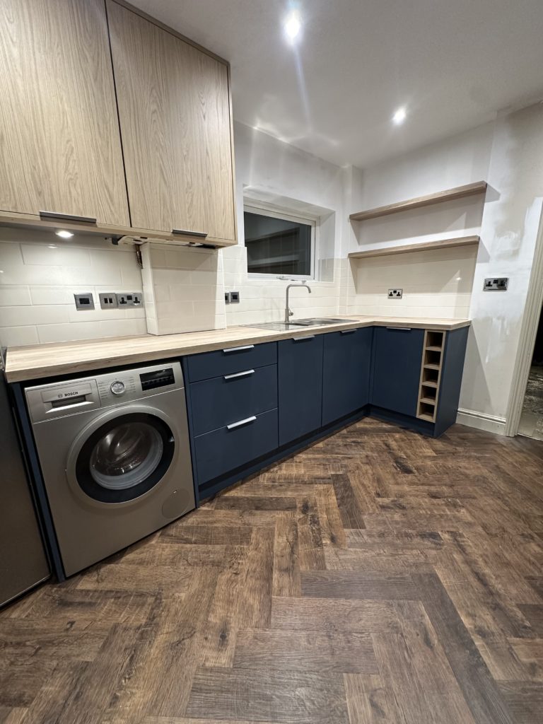 Kitchen installation in Norwich with shaker units and herringbone flooring